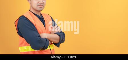 Engineers wear safety on color back ground. The inspectors crossed their arms proudly in the engineer project that they took the responsibility of ins Stock Photo