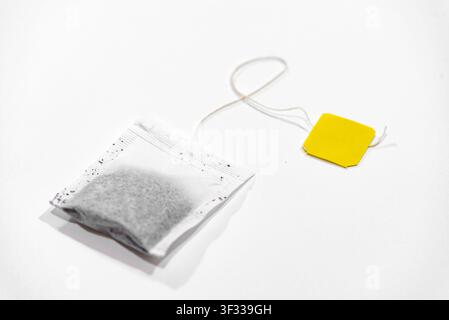 Single tea bag ready for brewing isolated on a clean white background Stock Photo