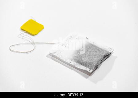 Single tea bag ready for brewing isolated on a clean white background Stock Photo