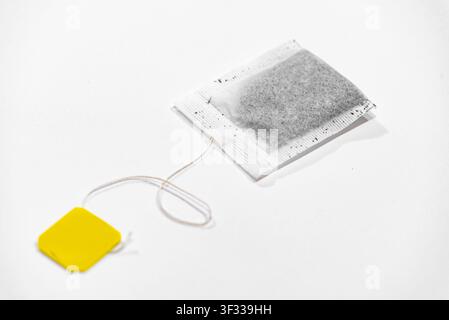 Single tea bag ready for brewing isolated on a clean white background Stock Photo