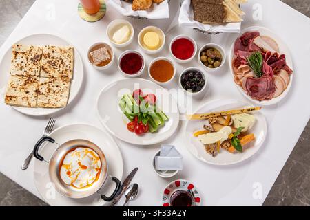 Traditional Turkish breakfast table with various dishes and tea Stock Photo