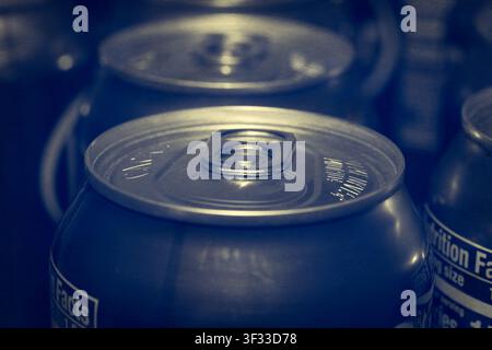 Macro close-up shot focusing on the pop top tab of a metallic beverage can with soft focus background Stock Photo