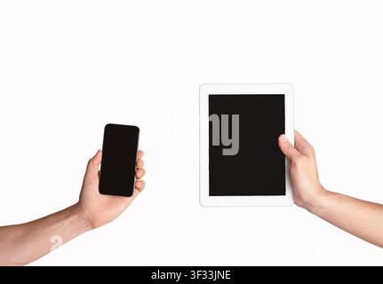 Modern cellphone and tablet computer in male hands, isolated on white. Collage with mockup for your design Stock Photo