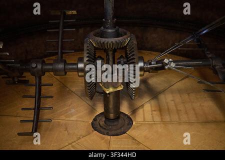 Close-up of traditional brewing machinery with interlocking gears and metal stirring arms inside Cantillon Brewery in Brussels, Belgium Stock Photo