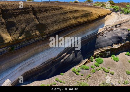 Diagonal bands of black and pale volcanic ash layers at La Tarta Stock Photo