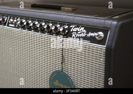 Close-up of a Fender Twin Reverb guitar amplifier showing the control panel and speaker grille, an iconic valve amplifier widely used by professional Stock Photo