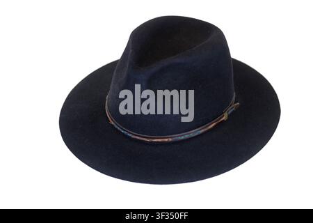 Black felt fedora hat featuring a wide brim and decorative leather band, isolated on a clean white background. Essential fashion accessory Stock Photo
