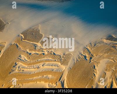 Aerial view of Nanarup Sand dunes showing intricate patterns of wind-blown sand, textures, and shadows in Albany, WA, Australia. Stock Photo
