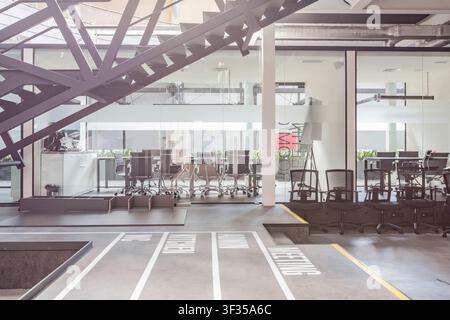 Empty workplace with computers and conference room Stock Photo