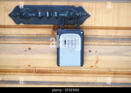 Lock box on a wooden door Stock Photo