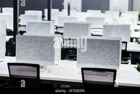 Empty places for workers in big empty rental office Stock Photo