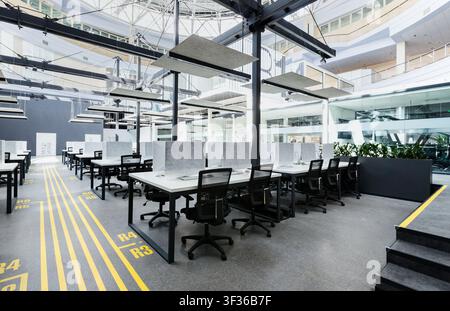Big rental office with wrapped computers, no workers Stock Photo