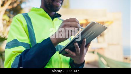 Architect, scroll and hands with tablet on construction site, project management and design research. Happy, civil engineer and person with technology Stock Photo
