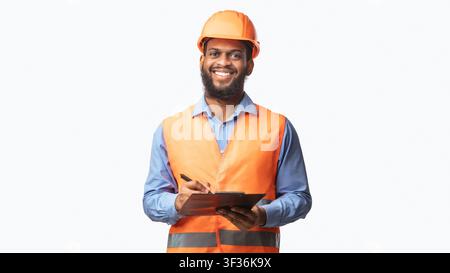 Happy Construction Worker Guy Taking Notes Holding Folder, Studio Shot Stock Photo