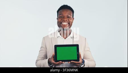 Portrait, tablet and black man with green screen in studio for business advertising on a white background. Happy, businessman and smile with Stock Photo