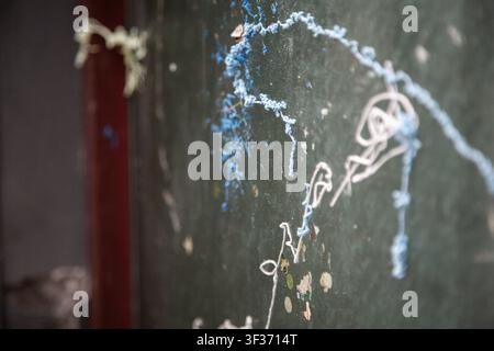 peeling paint off indoor wall closeup weathered aged decoration renovation blue white natural light clean background copy space modern bright warm Stock Photo