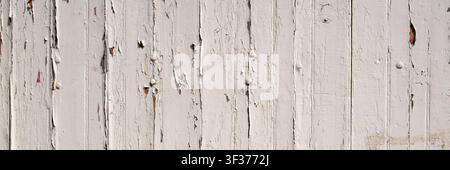 Panorama background texture of old white painted wooden boards with peeling paint Stock Photo