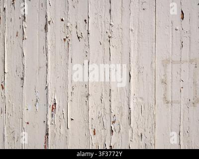 Background texture of old white painted wooden boards with peeling paint Stock Photo