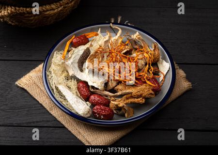 Mixed Dried Mushrooms And Chinese Herbs For Soup Base Stock Photo