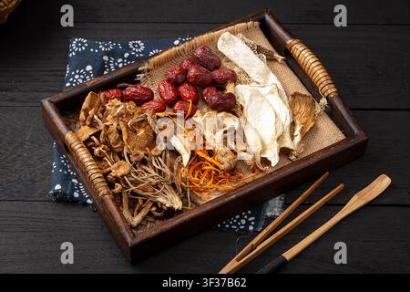 Mixed Dried Mushrooms And Chinese Herbs For Soup Base Stock Photo