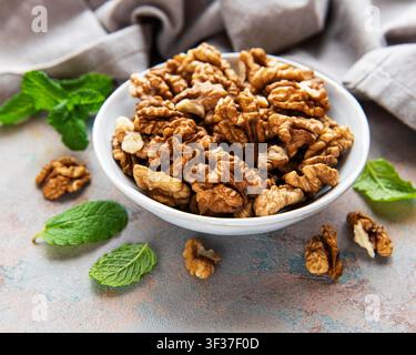 Walnuts without shell on a concrete background Stock Photo