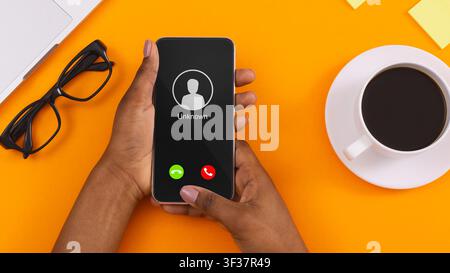 Female Hand Holding Phone With Incoming Call From Unknown Stock Photo