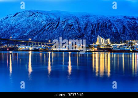 Tromso, Norway, 27.04.2026: View to Tromsdalen with Arctic Cathedral at midnight. Tromsdalen is an urban neighborhood in the city of Tromso, Norway, c Stock Photo