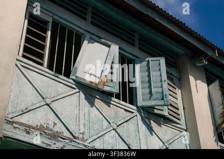Weathered Wooden Shutters on a Historic Heritage House in George Town Penang Malaysia Stock Photo