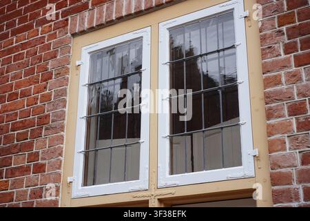 Potsdam, Germany - July 22, 2026: Architectural detail of a leaded window on a traditional red brick house in the Dutch Quarter. Stock Photo