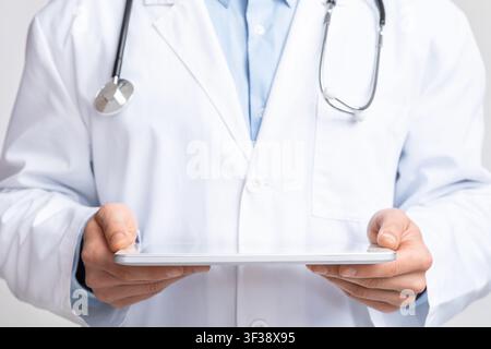 Digital tablet in hands of doctor, free space for hologram Stock Photo