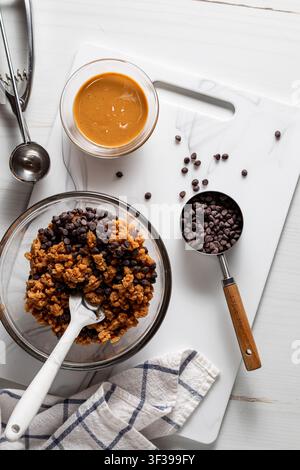 Ingredients used to make peanut butter and chocolate chip energy balls. Stock Photo