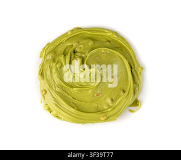 Pistachio cream isolated, dubai green chocolate butter, green nut paste. Creamy sweet smear, matcha icecream, pistachio mousse or sauce on white backg Stock Photo