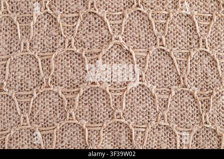 Beige woven jute knit with macrame honeycomb pattern and natural rope texture for decor Stock Photo