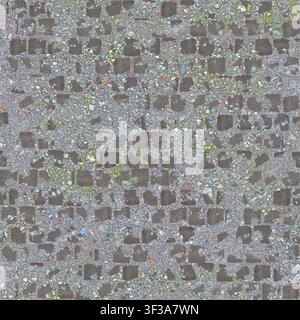 A top-down texture shot of old weathered cobblestones partially covered with dirt, sand, and fine gravel. Stock Photo