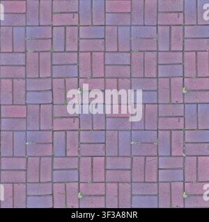 Top view of reddish purple rectangular concrete paving blocks laid in a basketweave interlocking pattern on an outdoor ground surface. Stock Photo