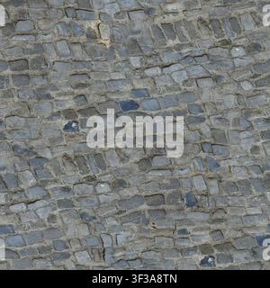 Top down seamless texture showing rustic grey stone cobblestone setts with uneven mortar joints in an old European style layout. Stock Photo