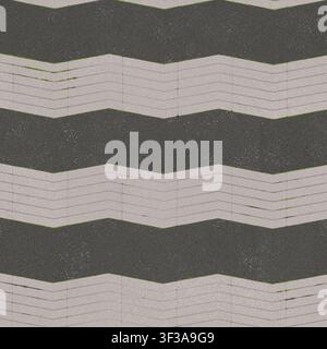 A high resolution seamless background texture featuring dark grey and light grey chevron paving blocks. Stock Photo