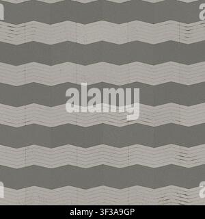 A seamless texture pattern of grey zigzag grooved paving stones for outdoor pavement or flooring. Stock Photo