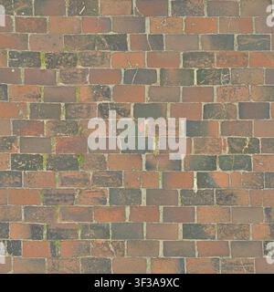 High angle view of weathered red and dark grey rectangular brick pavers forming a textured floor pattern. Stock Photo