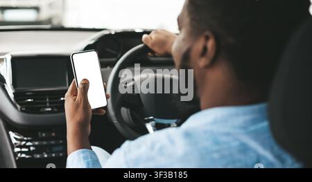 Unrecognizable Black Driver Using Mobile Phone Sitting In Automobile, Mockup Stock Photo