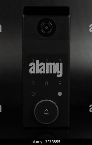 Doorbell with camera and keypad isolated on black studio background Stock Photo