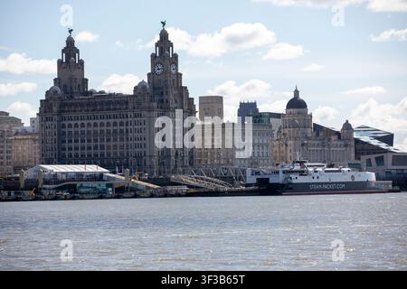 The iconic Liverpool waterfront skyline and Royal Liver Building viewed across the River Mersey, featuring an Isle of Man Steam Packet ferry. Stock Photo