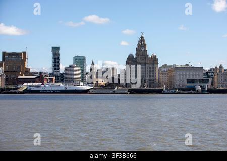 The iconic Liverpool waterfront skyline and Royal Liver Building viewed across the River Mersey, featuring an Isle of Man Steam Packet ferry. Stock Photo