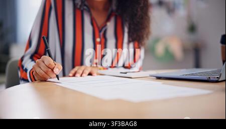 Hands, remote work and writing with woman in home office for contract, paperwork or signature. Agenda, approval and documents with freelance employee Stock Photo
