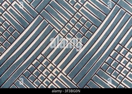 Blue and white textile texture featuring a modern architectural grid pattern. Geometric abstract pattern fabric background with copy space. Stock Photo