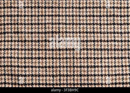 Brown plaid wool fabric texture background with copy space. Stock Photo