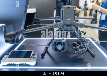 Bangkok, Thailand - July 22, 2026: Close-up of an industrial drone with dual camera and sensor payload alongside its remote controller at Internationa Stock Photo