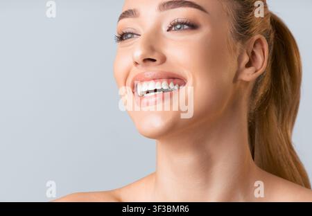 Close Up Portrait of a Young Woman Smiling Stock Photo
