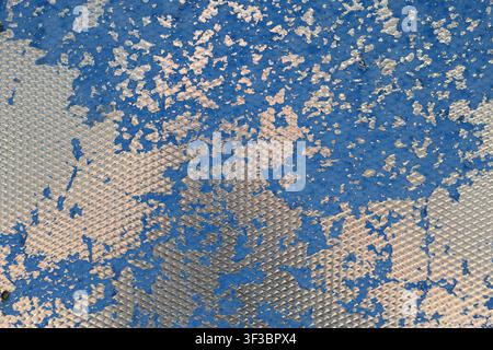Abstract Weathered Metal Texture with Worn Blue Paint and Geometric Pattern Stock Photo