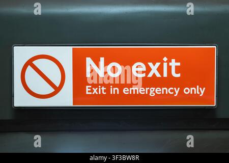 Red no exit sign with emergency exit only text Stock Photo
